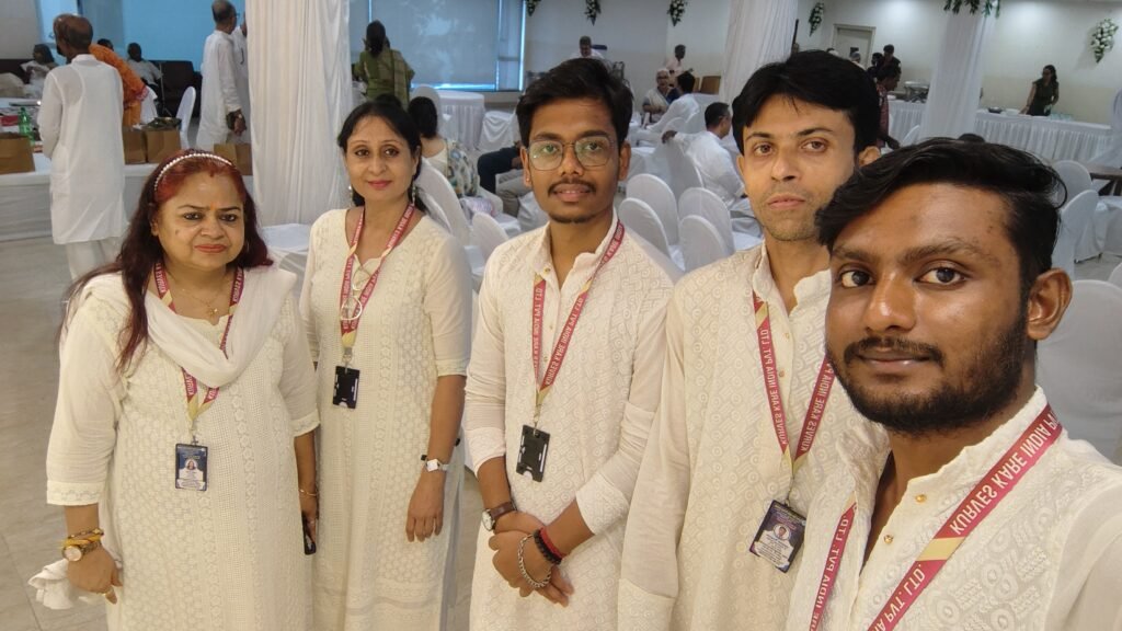 A smiling senior citizen in Kolkata enjoying a conversation with a professional elder care provider.